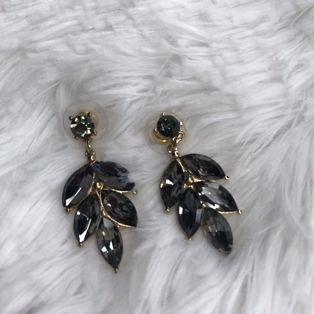 Leaf style gold earrings with black stones
